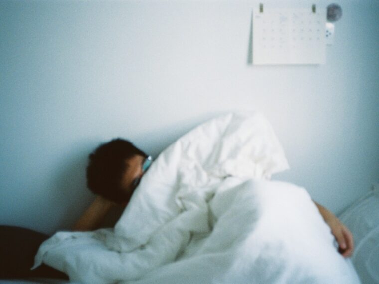 Calming cover illustration for Sleep hygiene for insomnia showing a dim lamp, notebook, mug, and early‑dawn window