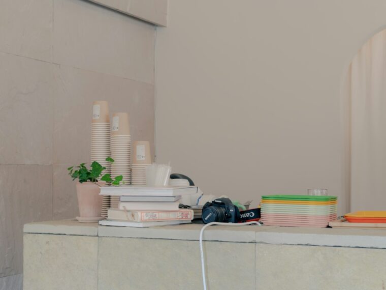 Cover image for skin maintenance routine with simple bottles, towel, water glass, and sunrise/moon icons