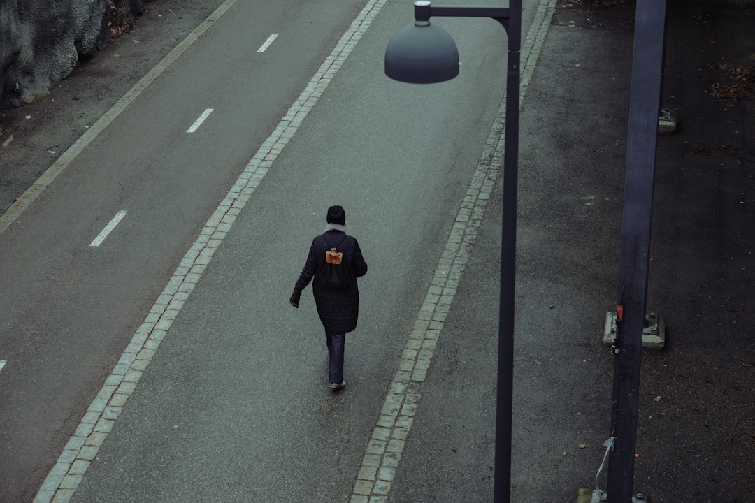 low-impact workout routines cover showing marching, squats, step-ups, and a heart-rate line